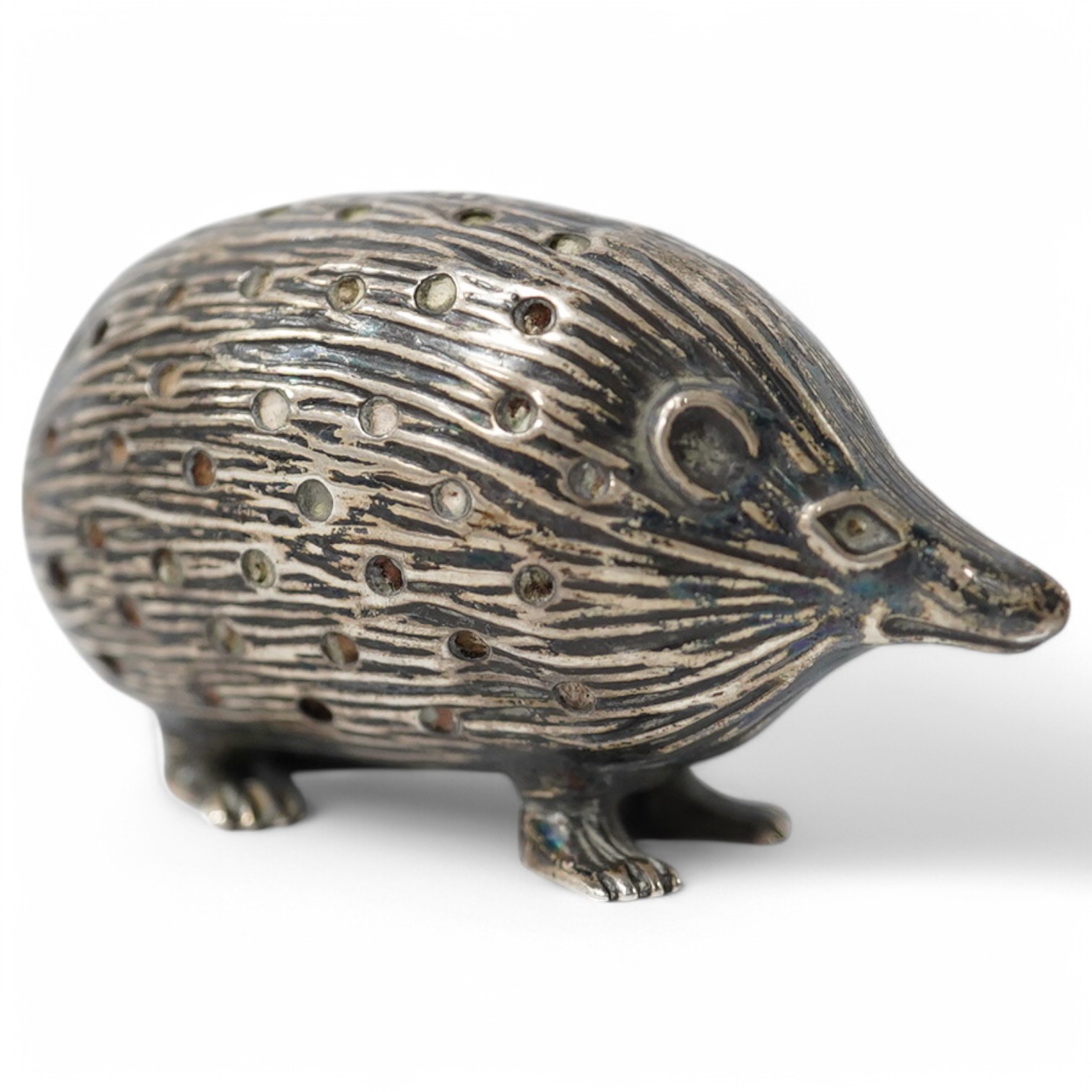 An Edwardian novelty silver pin cushion, modelled as a hedgehog, Adie & Lovekin Ltd, Birmingham, 1906, 52mm. Condition - fair to good